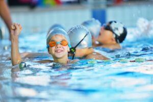 Child celebrating winning a swimming race